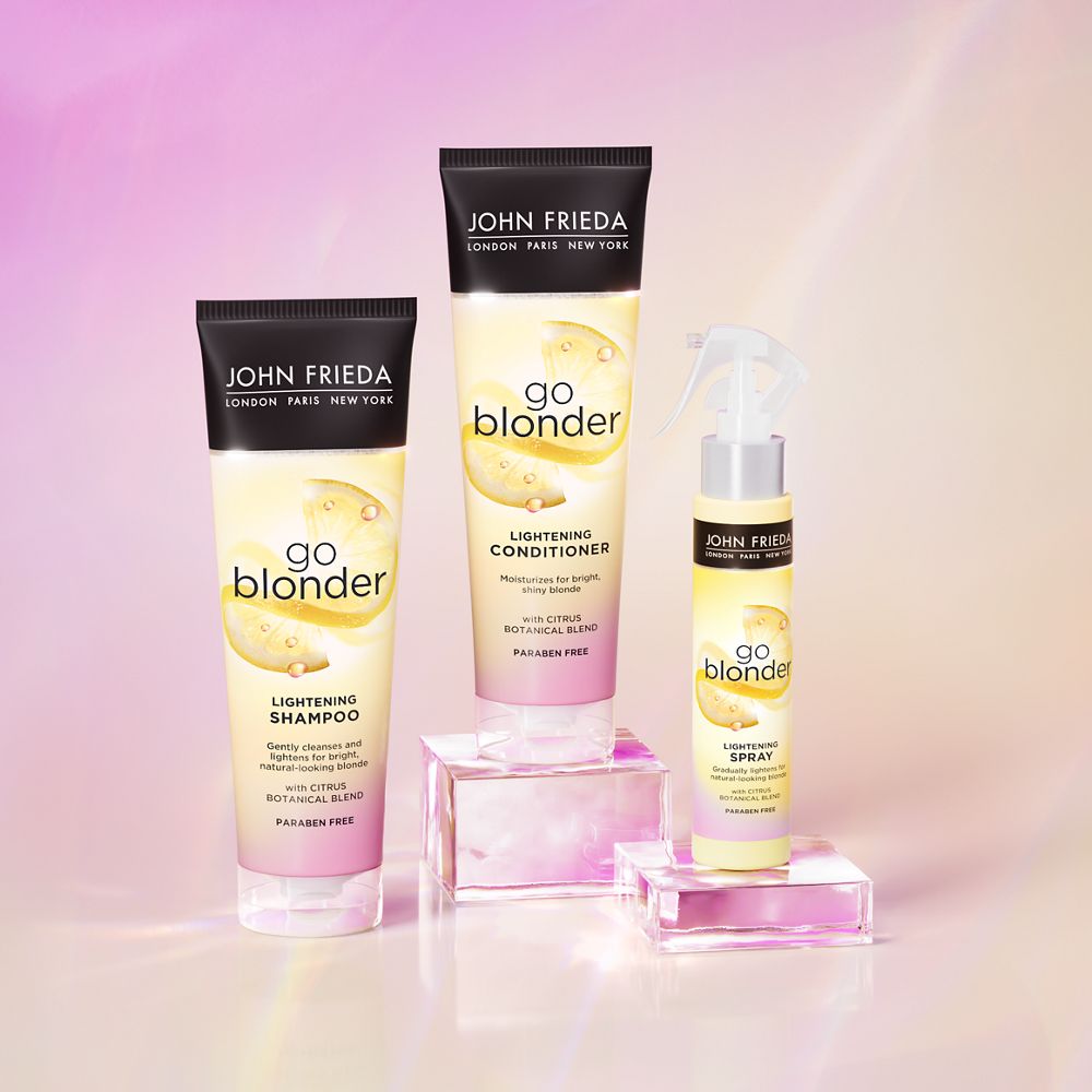 John Frieda's Go Blonder® Bundle collection with Go Blonder Shampoo, Conditioner, and Lightening Spray.